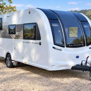 Bailey Alicanto Grande Lisbon caravan: front three-quarter exterior view showing side graphics and hitch.